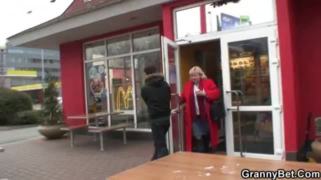 Young guy picks up huge old grandma in cafe