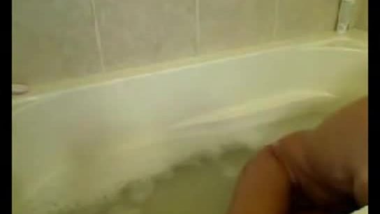 Tan skinny blonde naked in tub
