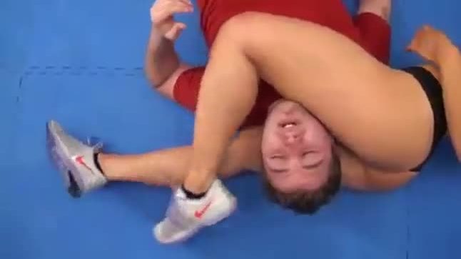 Mixed wrestling with beautiful strong brunette